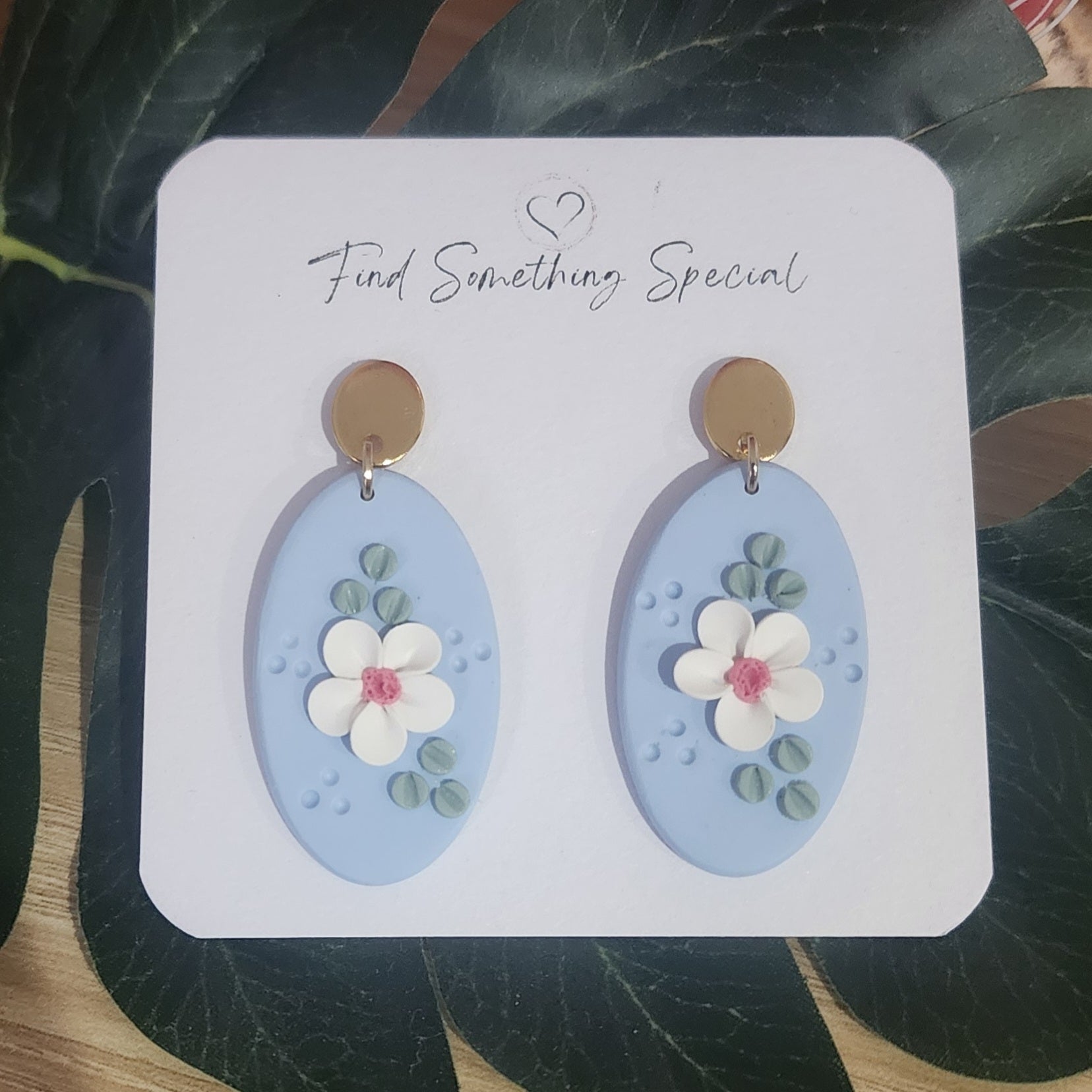 Polymer Clay Earrings - white Floral design on Blue Oval Polymer Clay Earrings - white Floral design on Blue Oval